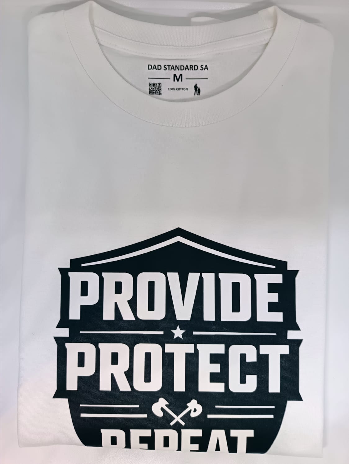 White t-shirt with 'Provide Protect Repeat' text design on a plain background